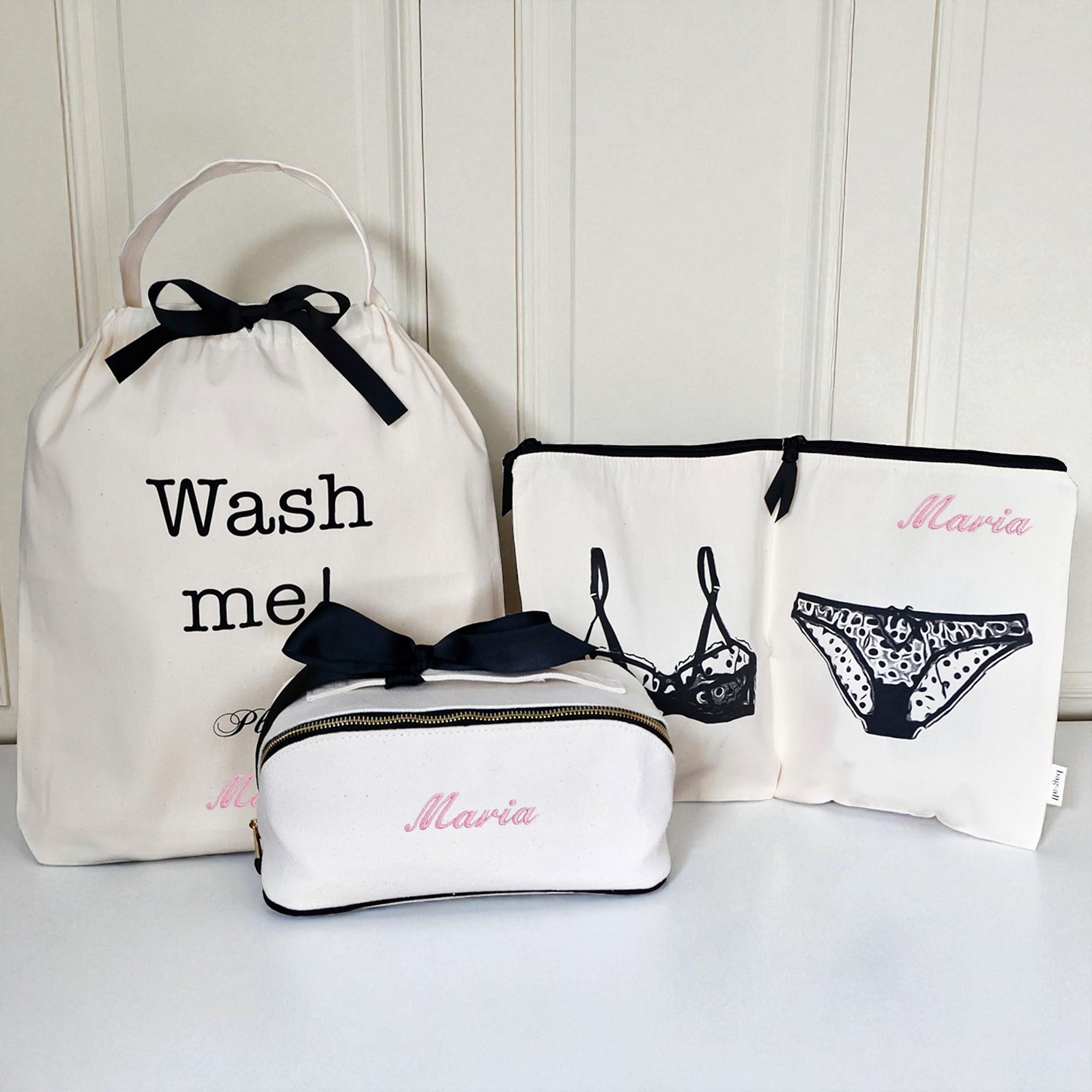 Cream 3-pack underwear and laundry organizer set with personalized name and black bow accents by Bag-all