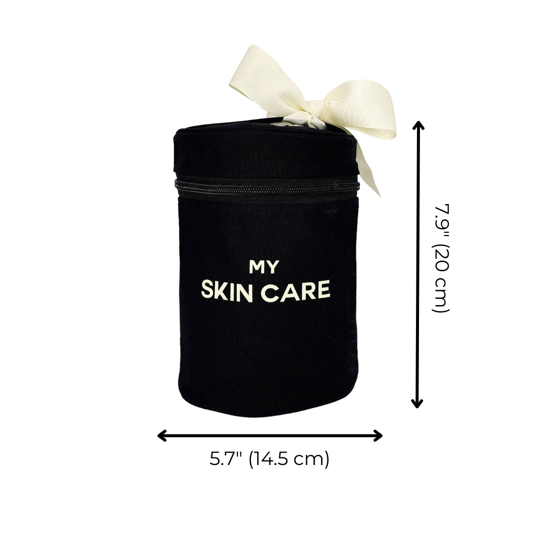 Bag-all Round Skin Care Case with Handle in black, featuring white bow accent and "MY SKIN CARE" text, cylindrical design measuring 7.9x5.7 inches, perfect for beauty storage