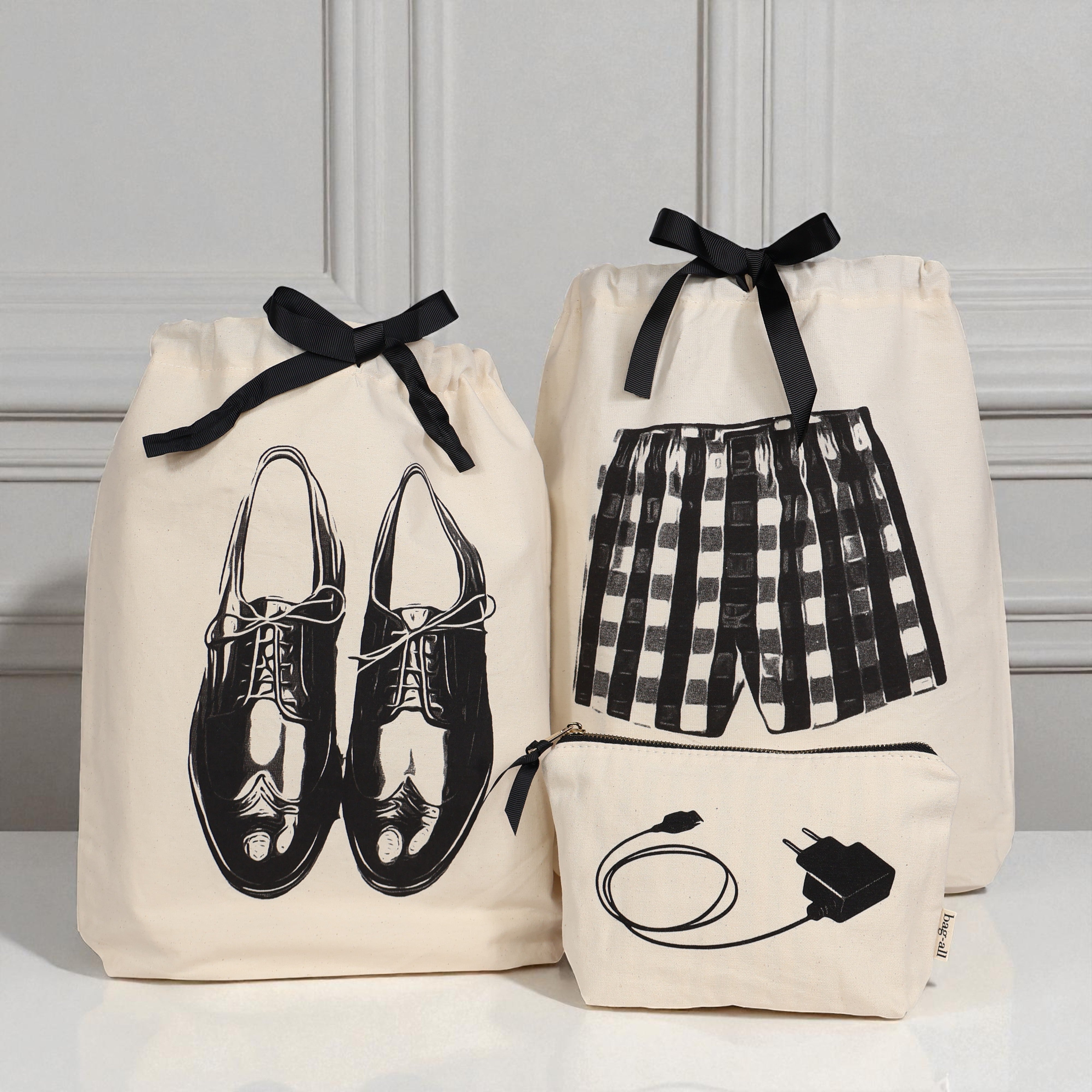 Bag-all cream travel and tech organizers set with shoe, shorts, and charger illustrations for stylish organization