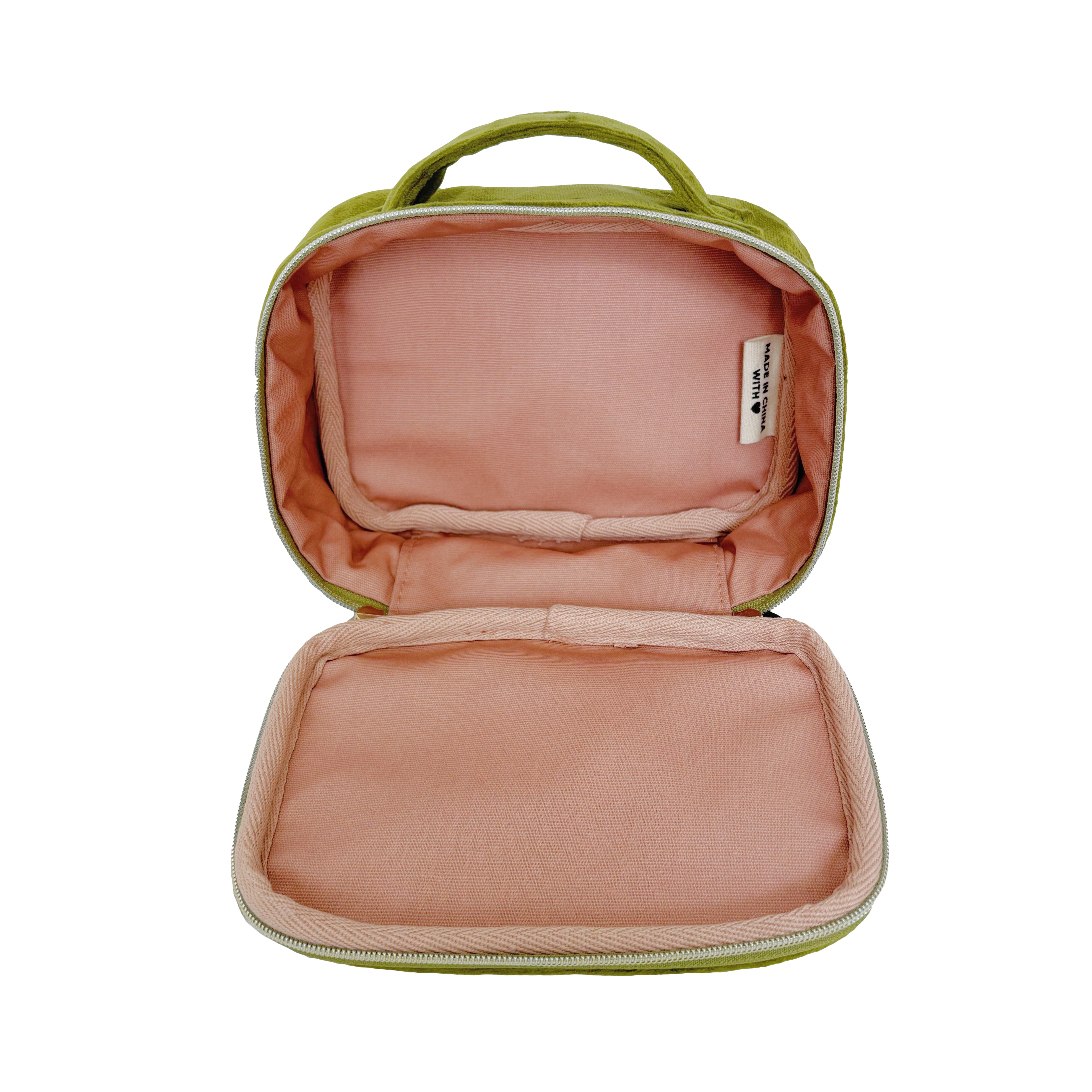 Bag-all Green Velvet Pill Box with Handle & Weekly Organizer featuring pink interior, zippered compartment, sustainable eco-friendly design for medication storage and travel