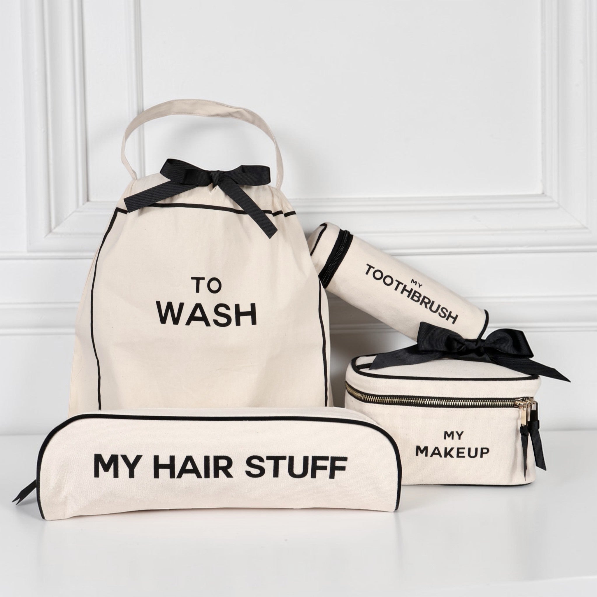 Bag-all cream travel set with To Wash bag, My Hair Stuff pouch, My Makeup box, and My Toothbrush case