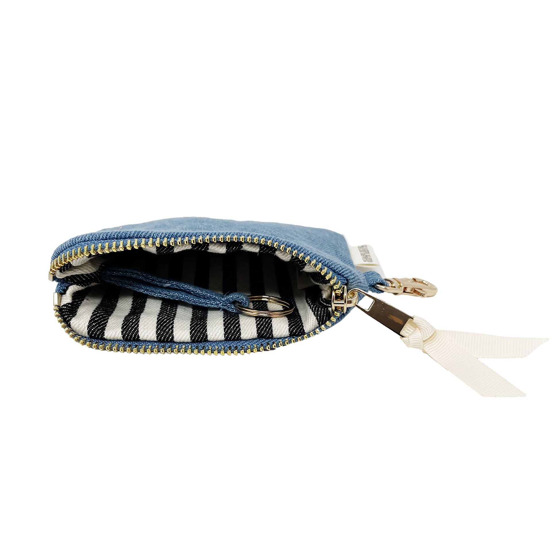 Bag-all Mini Trinket Pouch in Denim with black and white striped interior, gold zipper, and white ribbon detail - compact organizer for small essentials