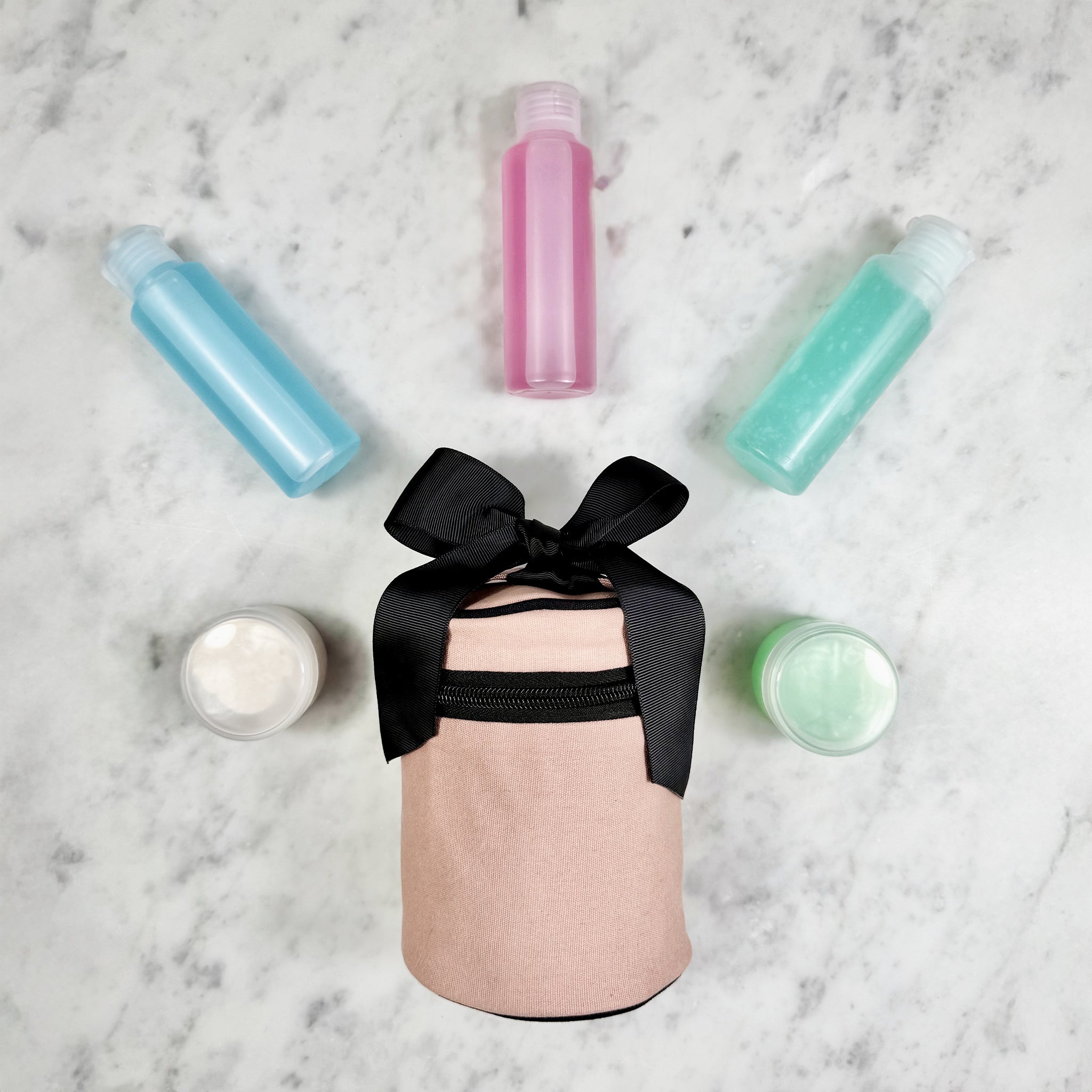Bag-all pink blush carry on essentials set with travel bottles and containers organized for easy packing and use