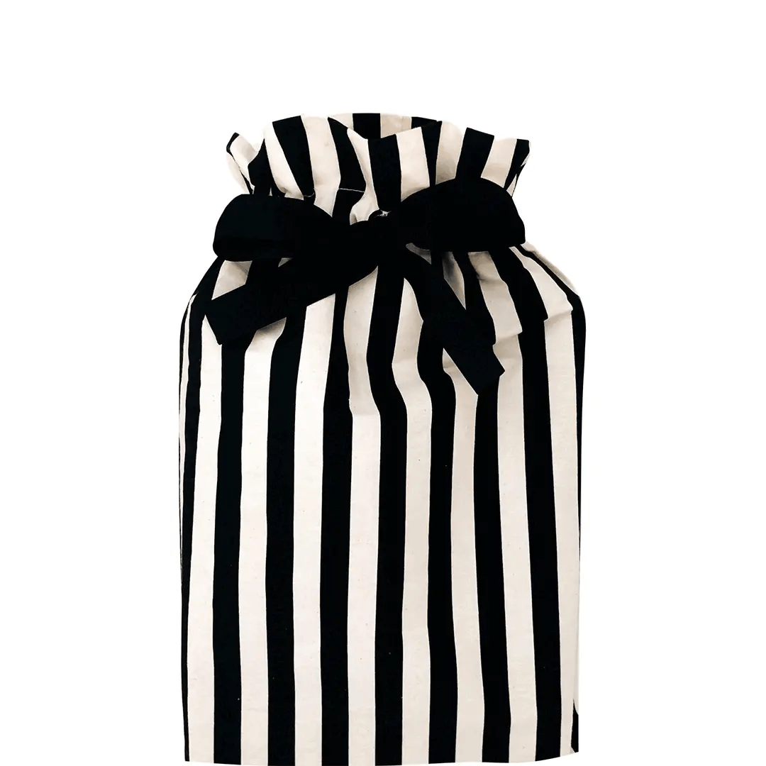 Bag-all Gift Bag Striped Medium featuring black and white vertical stripes with elegant black bow closure, reusable cotton gift wrapping solution