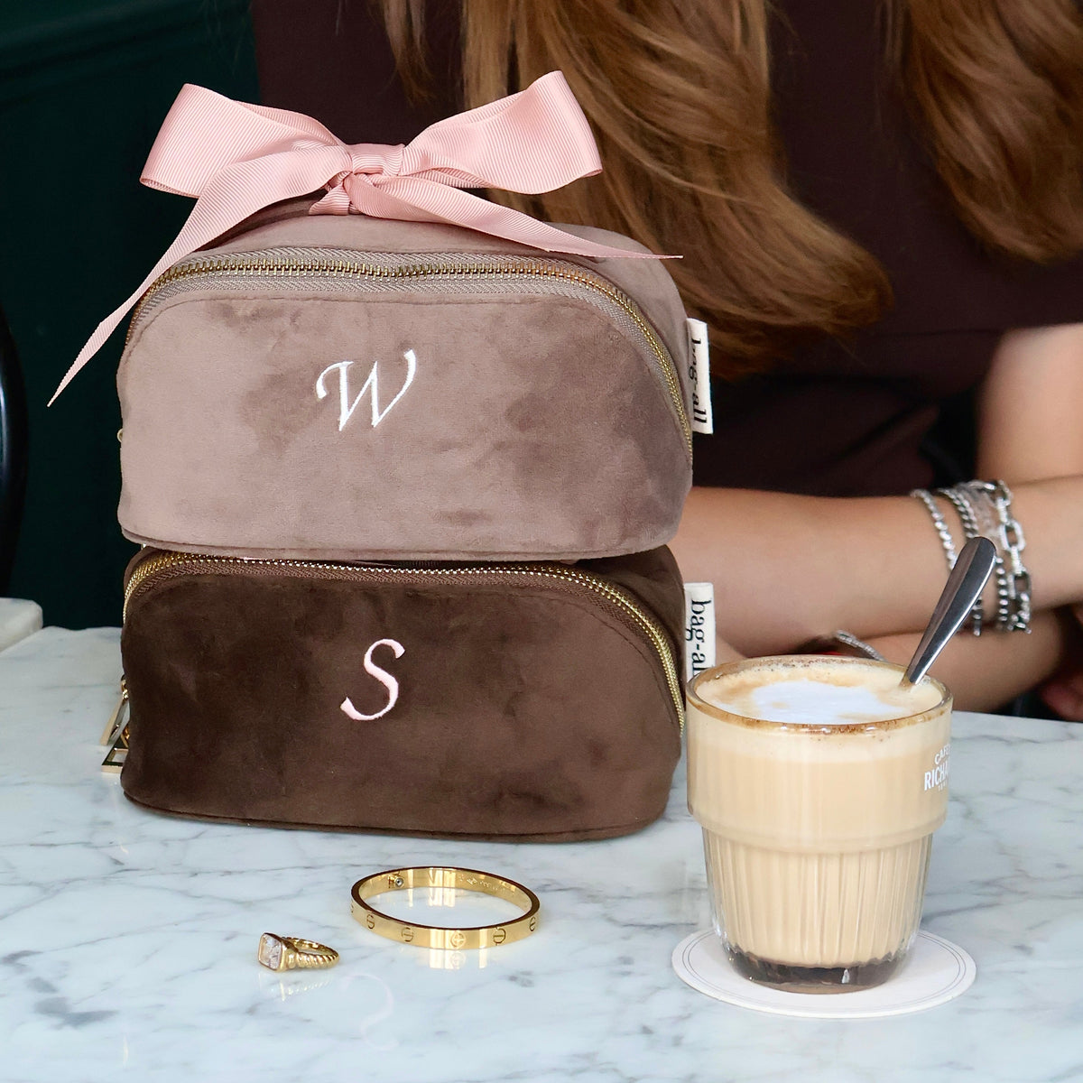 Bag-all Petite Accordion Makeup Case – Eco Velvet – Espresso Brown with personalized velvet cases stacked for travel organization