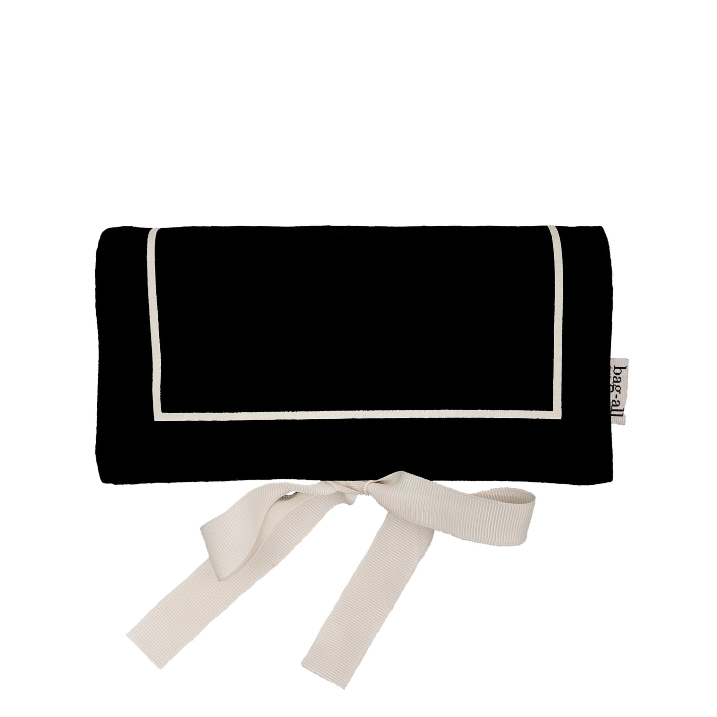 Bag-all Couture Jewelry Roll Medium in black cotton with white trim and ribbon ties, perfect for organizing jewelry on the go
