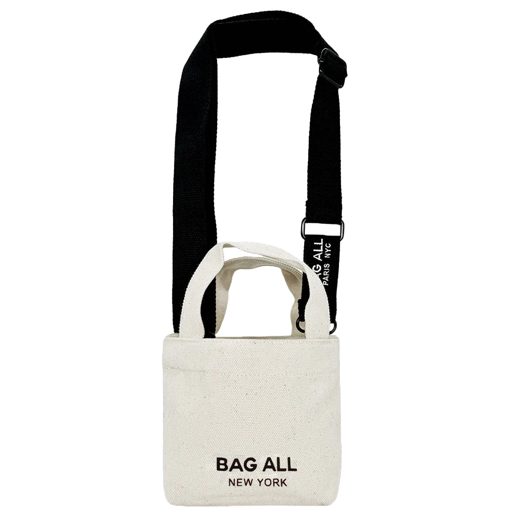 Bag-all Mini Tote Bag with Strap in cream cotton featuring adjustable black shoulder strap, interior pocket, and classic New York branding