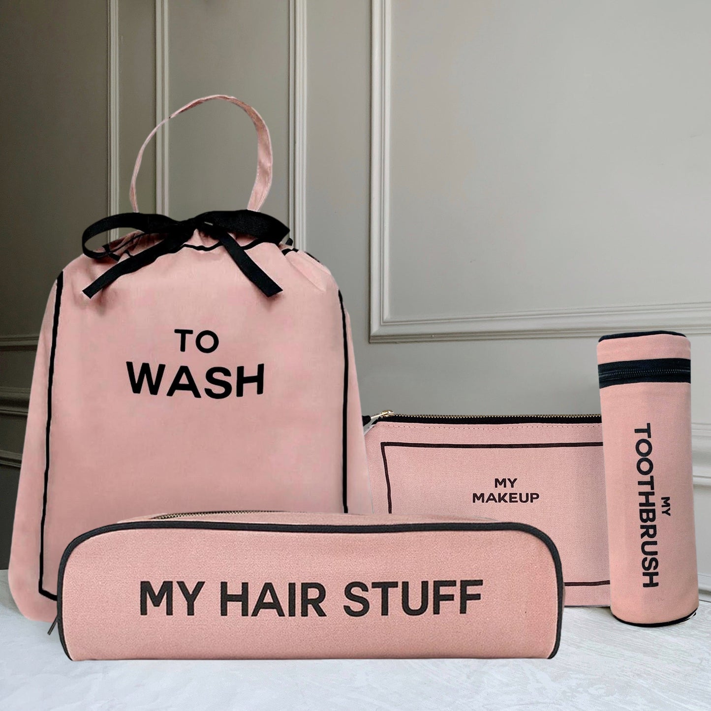 Bag-all Best Deal Gift Set featuring pink cotton travel organizers: To Wash laundry bag, My Makeup pouch, Hair Stuff case, and Toothbrush holder with black text and bows