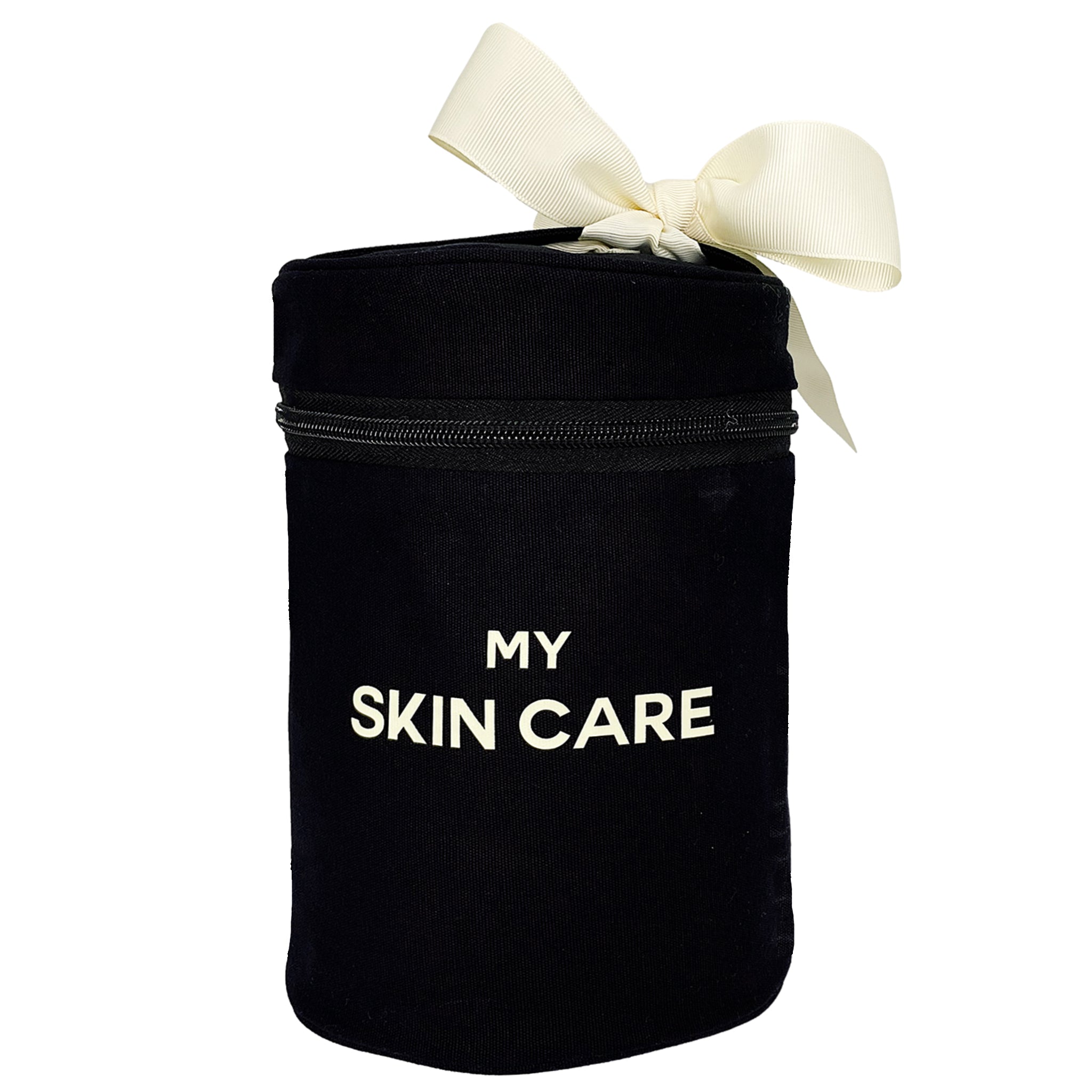 Bag-all Round Skin Care Case with Handle in black cotton featuring cream bow, white text 'MY SKIN CARE', zippered compartment for beauty storage and organization