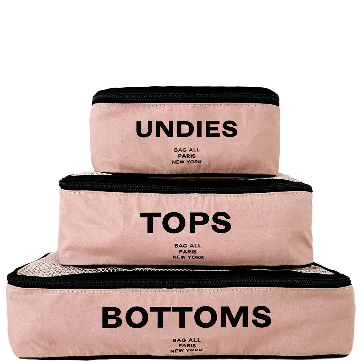 Bag-all pink travel packing cubes labeled UNDIES TOPS and BOTTOMS for organized packing
