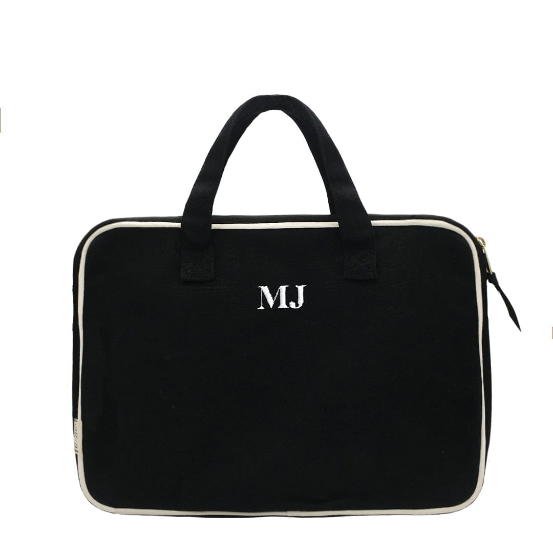 Bag-all Black Laptop Case 13" with handles and charger pocket, featuring white trim, monogram detail, padded protection and front storage compartment for accessories
