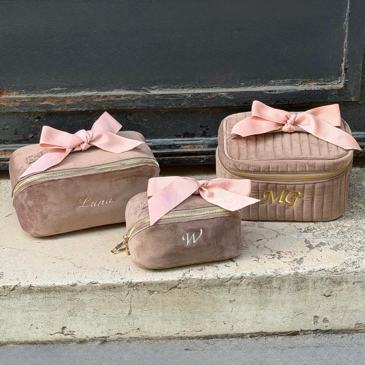 Bag-all personalized travel organization pouches in taupe velvet with pink bows and embroidered initials