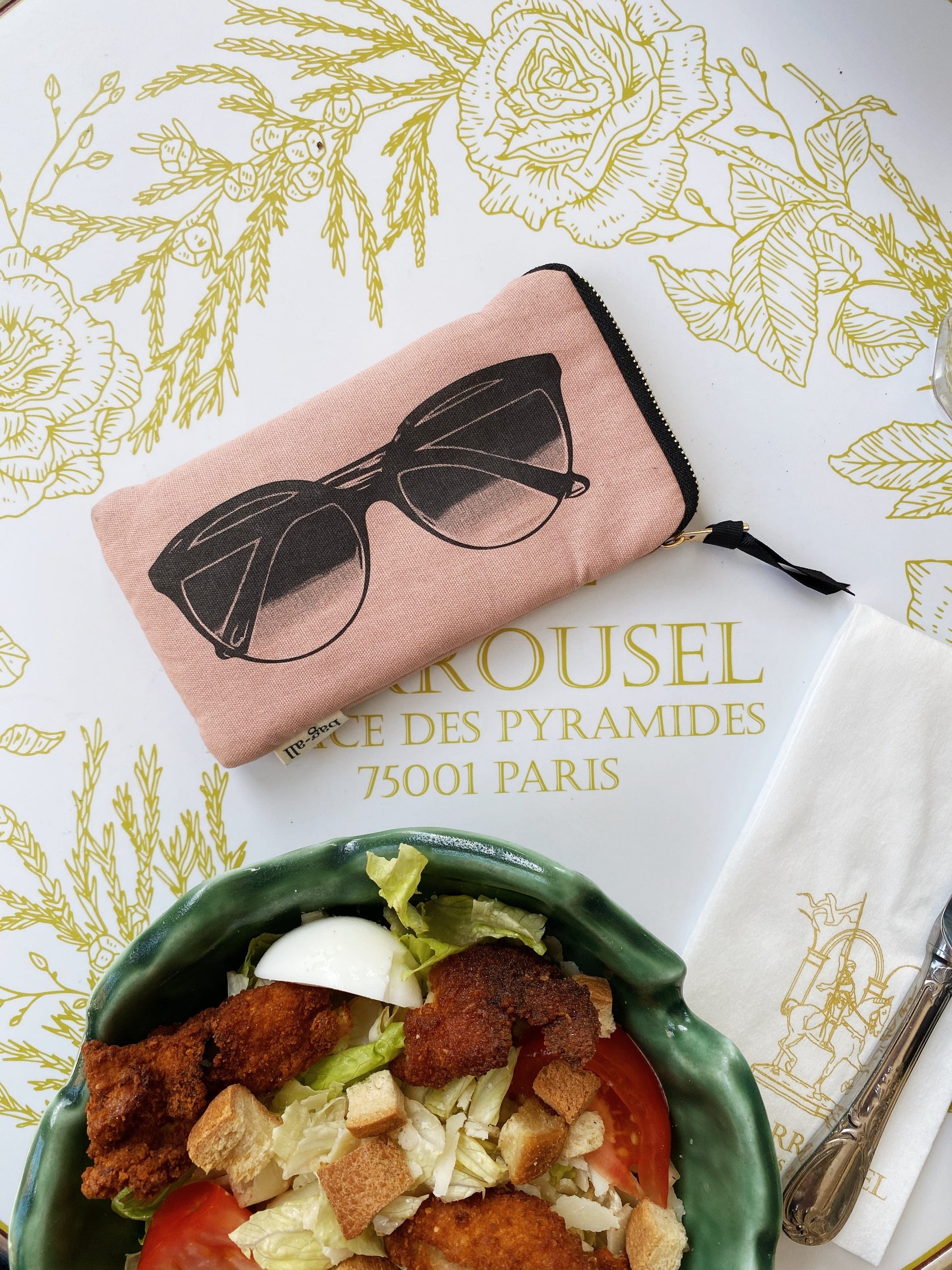 Bag-all Pink Glasses Case with Outside Pocket featuring sunglasses print design, gold zipper, and extra storage compartment. Blush-colored protective case for eyewear storage and organization