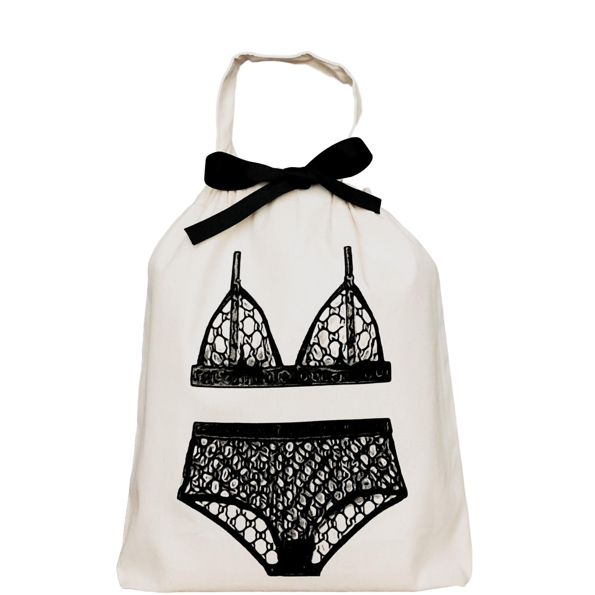 Bag-all London Lingerie Travel Bag in cream cotton with black lingerie illustration and bow, featuring elegant bralette and underwear design for stylish organization