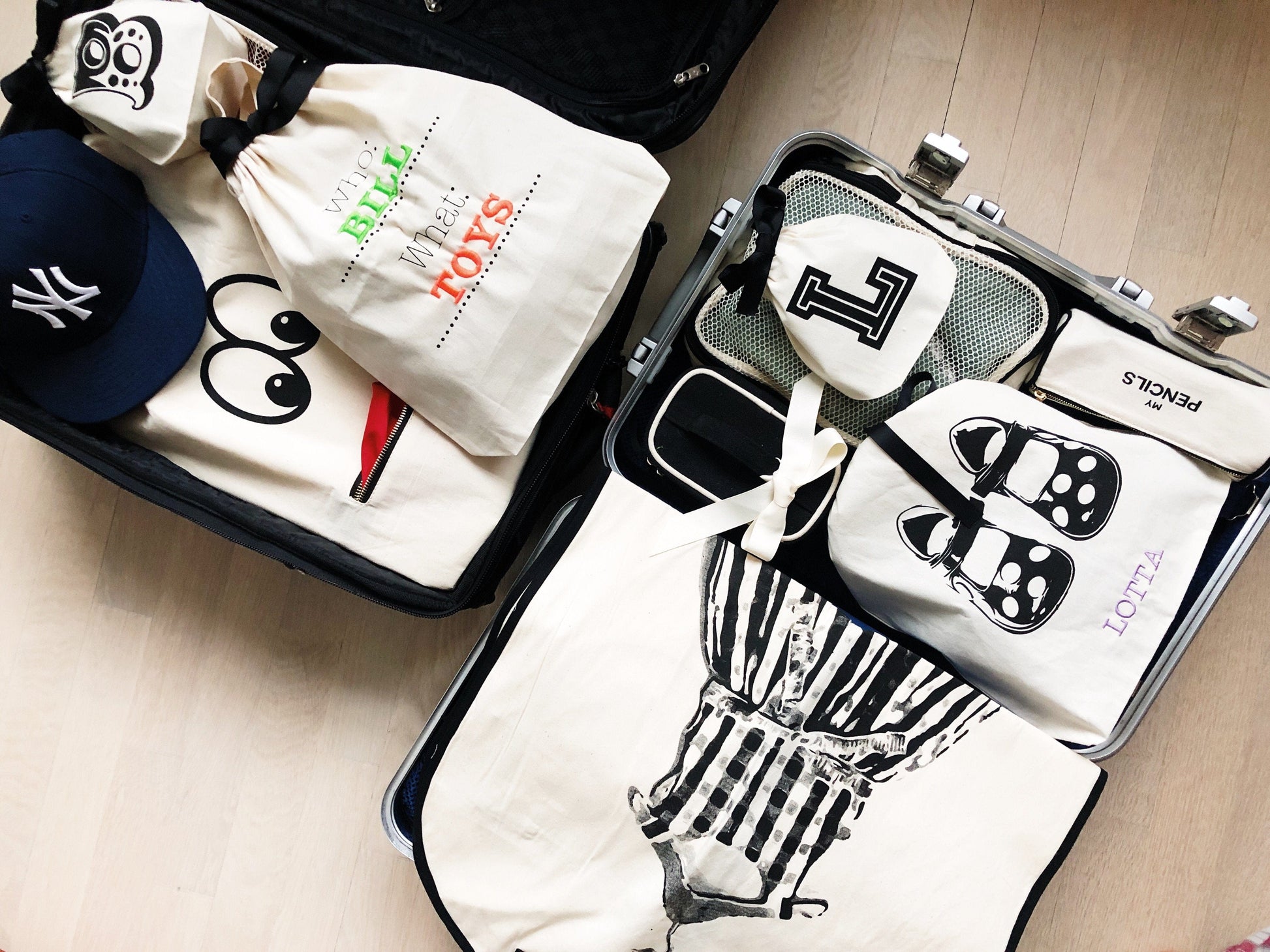 Bag-all Who What Bag in cream cotton canvas, featuring customizable monogram spaces for organized storage, perfect for versatile organization and personalized labeling of belongings