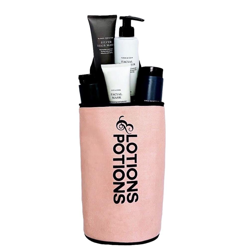 Bag-all Lotions & Potions Travel Case in blush pink, filled with toiletry bottles, featuring waterproof lining and cylindrical design for organized travel storage