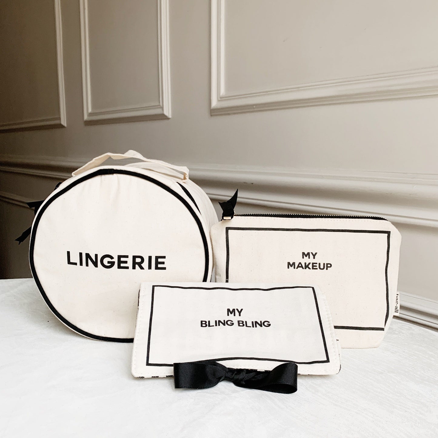 Bag-all Deal Gift Set for Her featuring cream cotton cases: Round Lingerie Case, Makeup Case, and Jewelry Case with black text and bow details, perfect for stylish organization