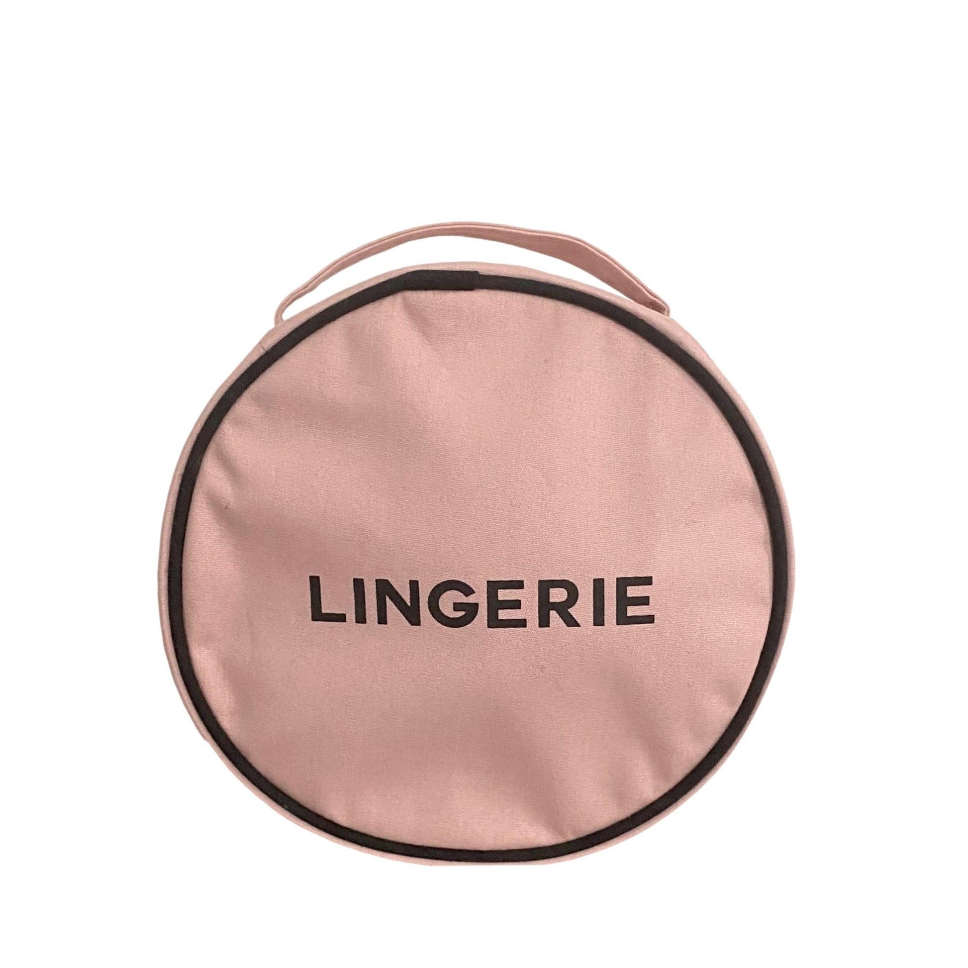 Bag-all Round Lingerie Case in blush pink cotton, featuring black trim and text, metal zipper, perfect for travel organization and stylish storage