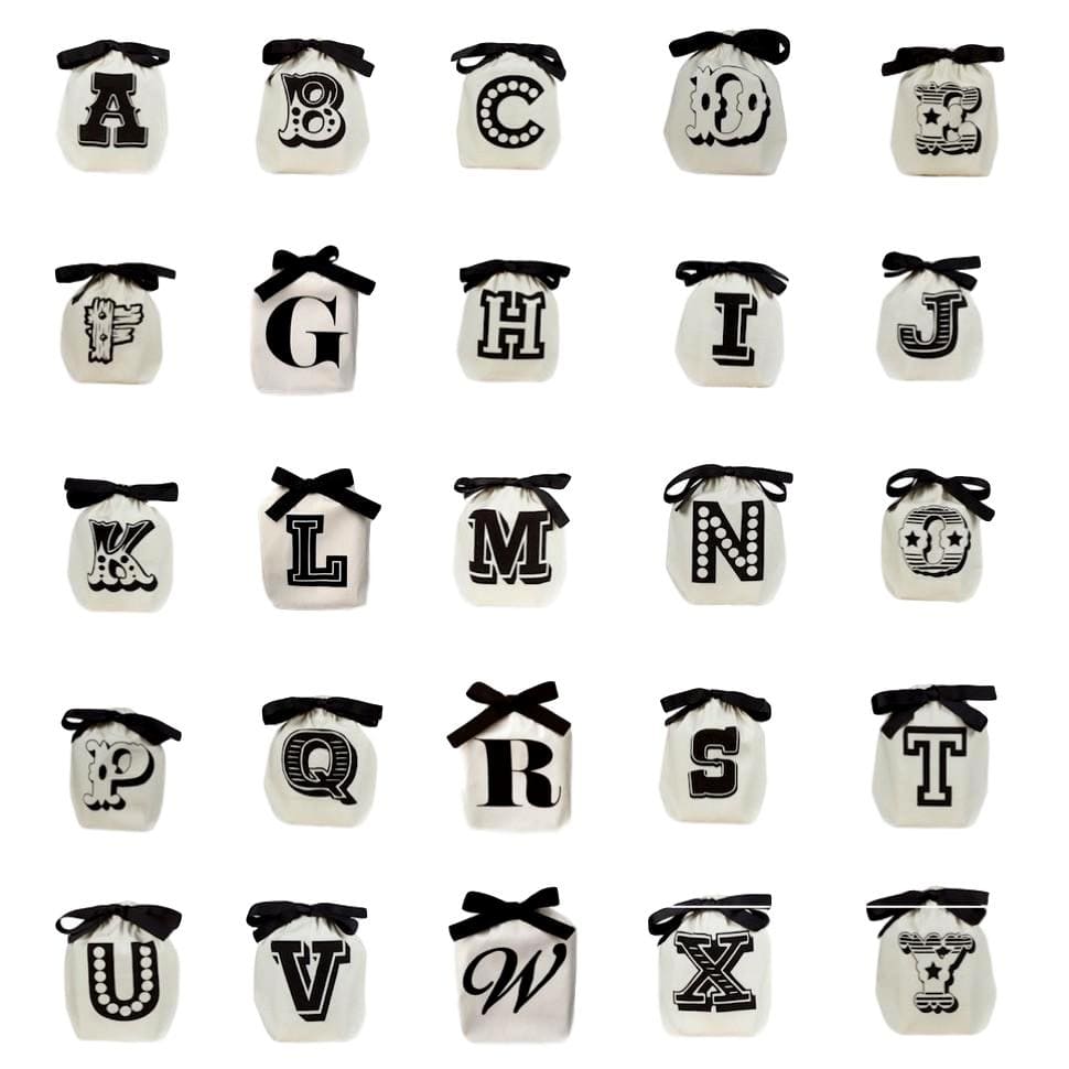 Bag-all Small Letter Bags Mix in cream featuring alphabet A-Z on individual cotton bags with black bows, perfect for organizing small items and collectibles
