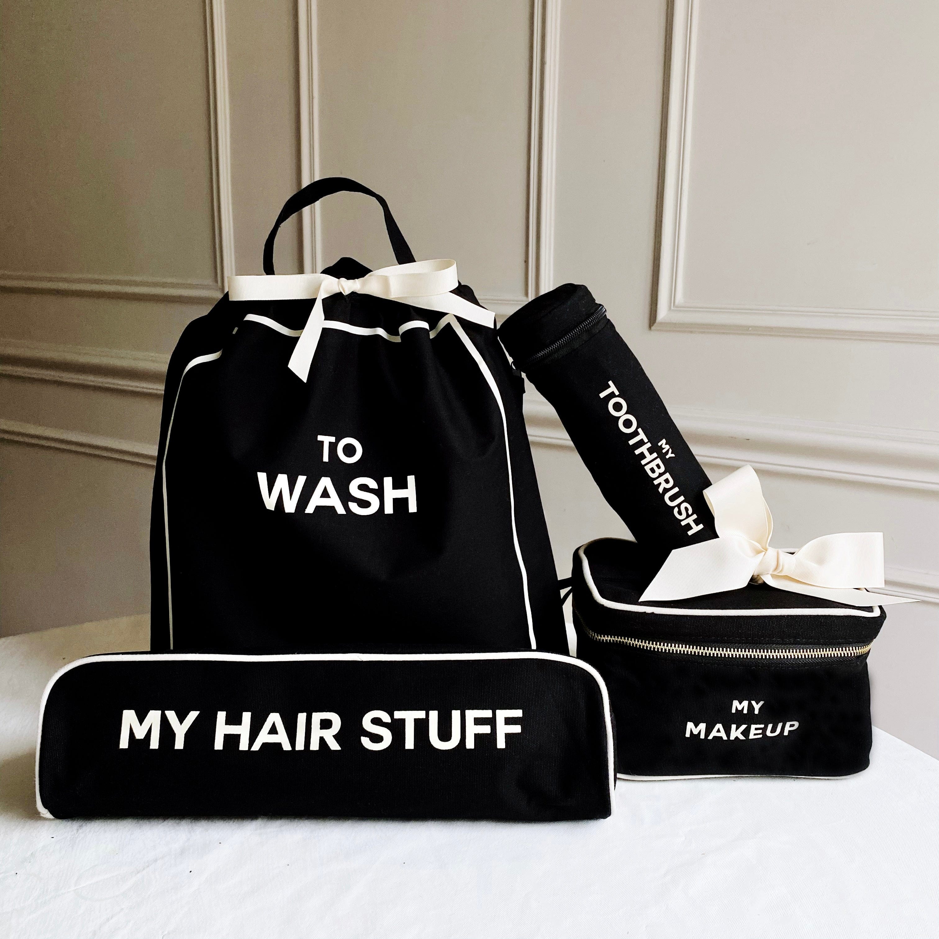 Bag-all Deal Gift Set featuring black cotton travel organizers: To Wash laundry bag, Hair Stuff case, Toothbrush holder, and Makeup box with white trim and text