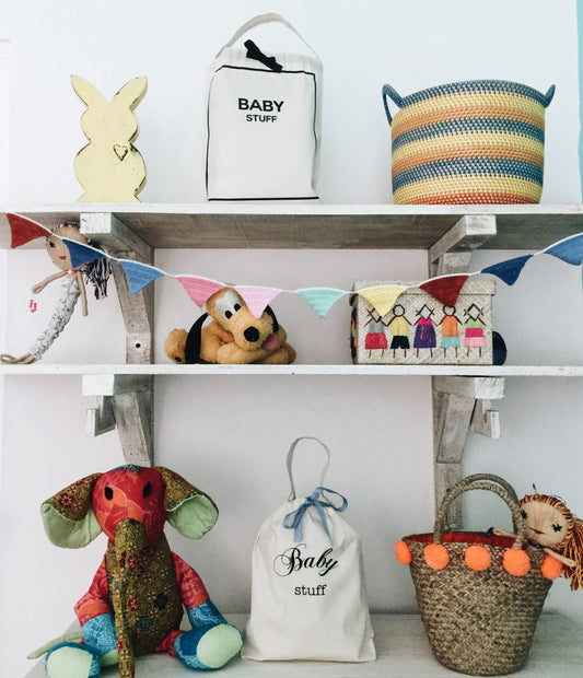 Baby bedroom with toys and organizing bags. 