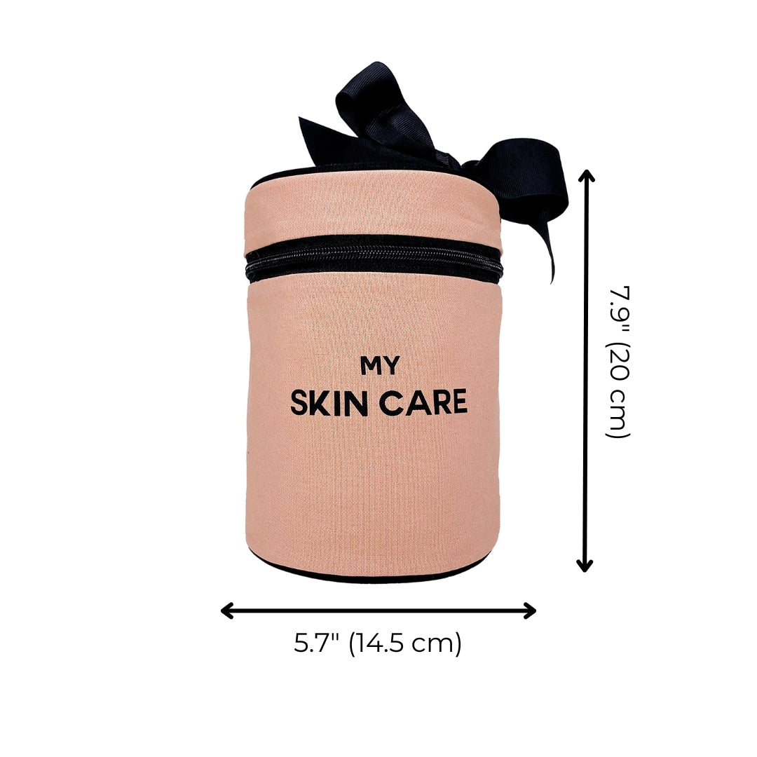 Bag-all Round Skin Care Case with Handle in Pink/Blush featuring black bow accent, text 'MY SKIN CARE', zip closure, 5.7" width, 7.9" height, ideal for beauty organization