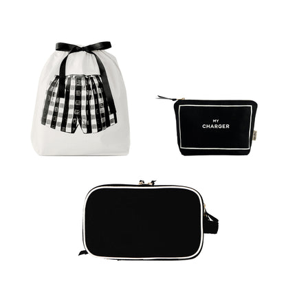 Bag-all Men’s Essentials Gift Set with black toiletry, tech, and travel organizers in a white drawstring pouch with bow