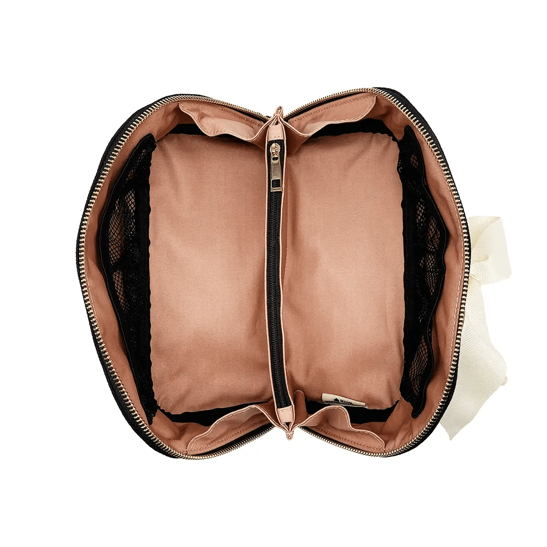 Interior of Bag-all Accordion Box Makeup & Toiletry in Black. Features pink lining, mesh pockets, and a zippered divider for organization