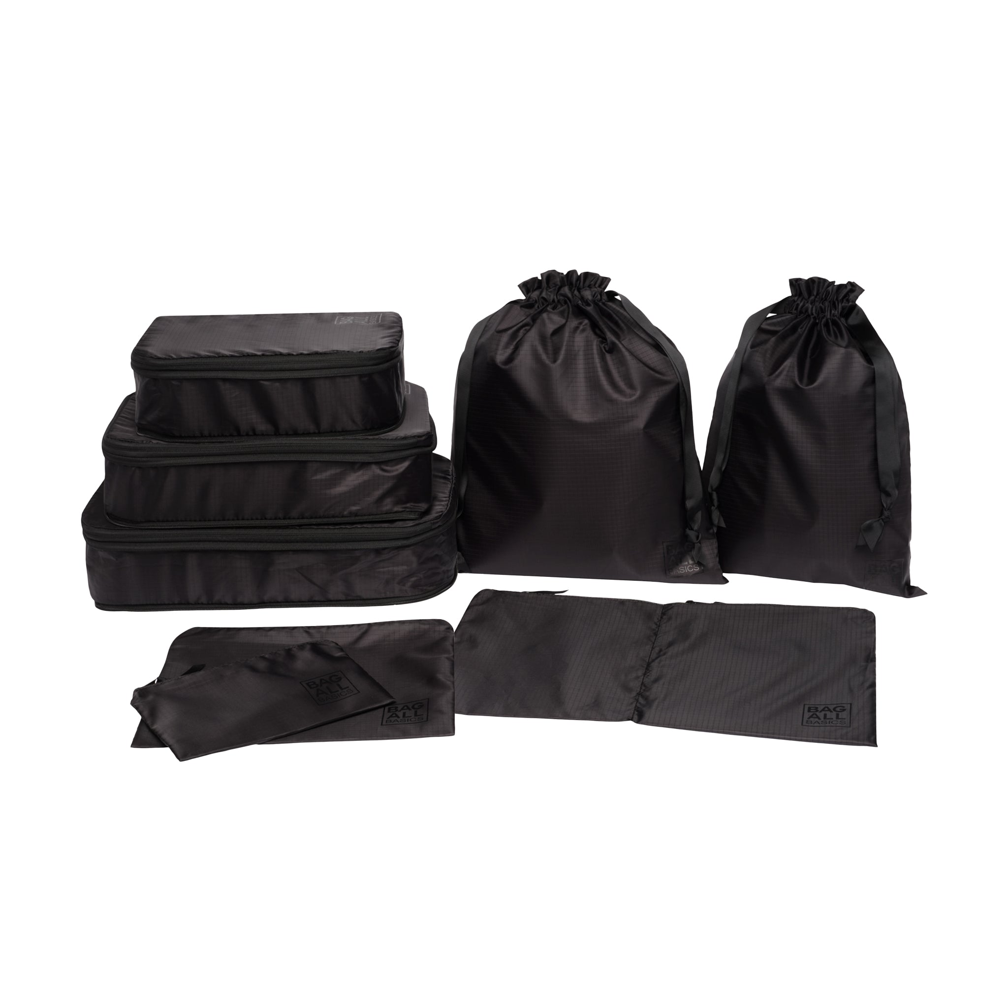 Bag-all Compression Cubes & Packing Bags Set in black recycled nylon featuring 8 pieces: 3 compression cubes, 2 packing cases, and 3 drawstring bags for efficient travel organization
