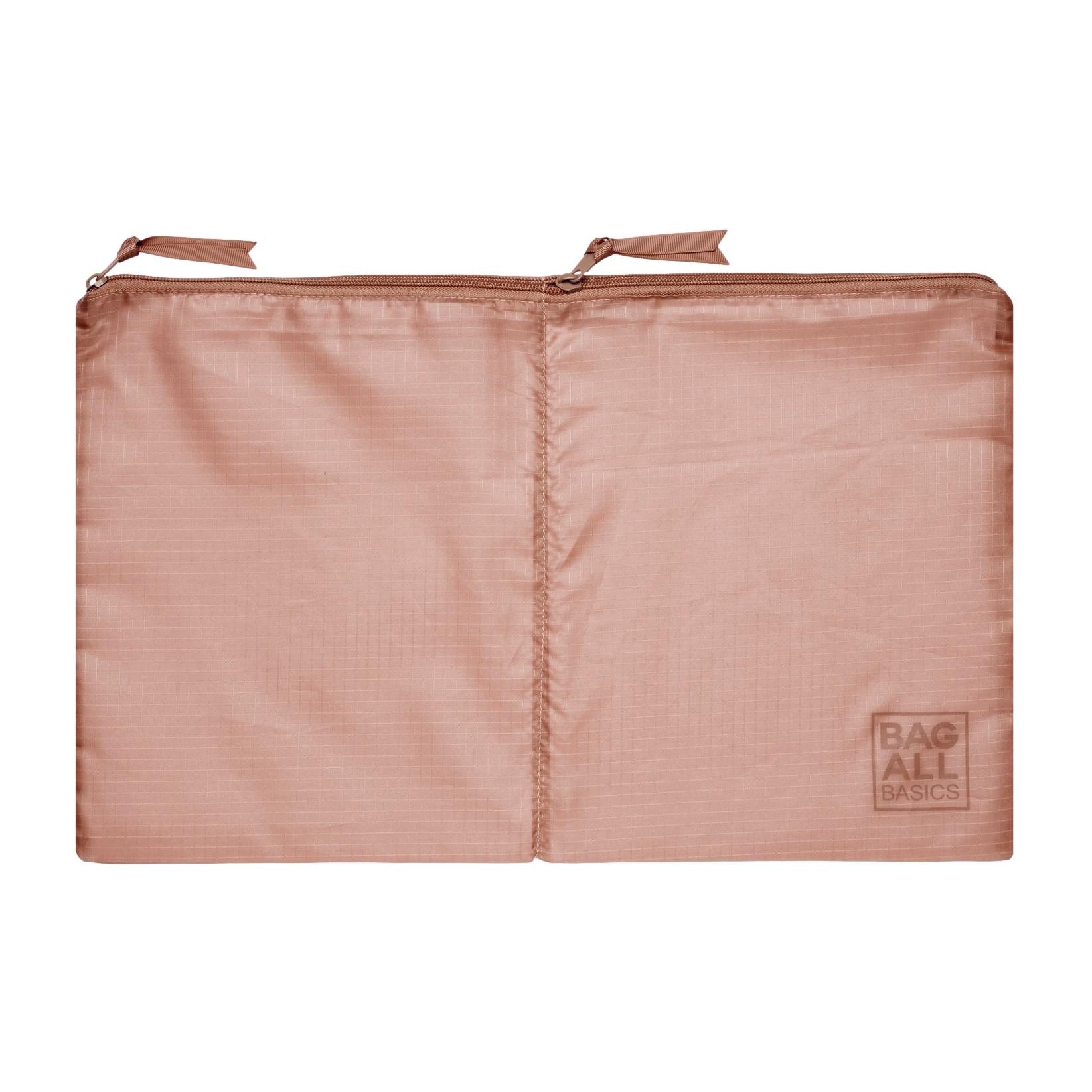Bag-all Packing Bags Set in recycled pink nylon featuring double compartment design, part of sustainable 5-pack travel organizer collection made from repurposed plastic bottles