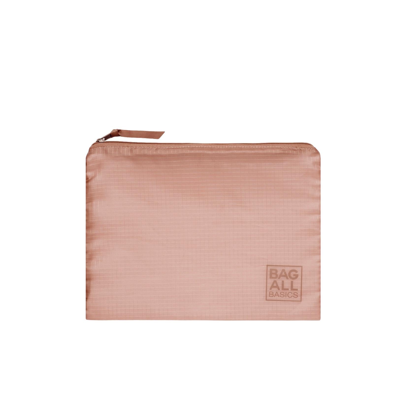 Bag-all Pink Recycled Nylon Packing Bag with zip closure, part of 5-pack travel organizer set, featuring embossed logo and sustainable design