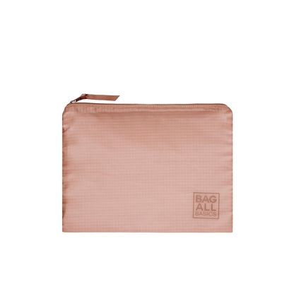 Bag-all Pink Recycled Nylon Packing Bag with zip closure, part of 5-pack travel organizer set, featuring embossed logo and sustainable design