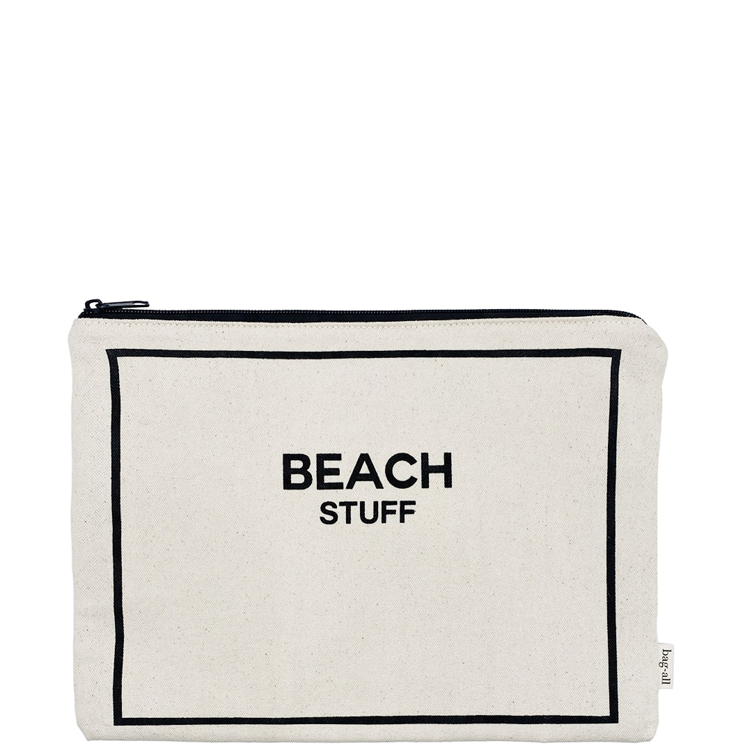 Bag-all cream cotton Beach Stuff pouch with black border and text, featuring waterproof lining and metal zipper for storing beach essentials and swimwear