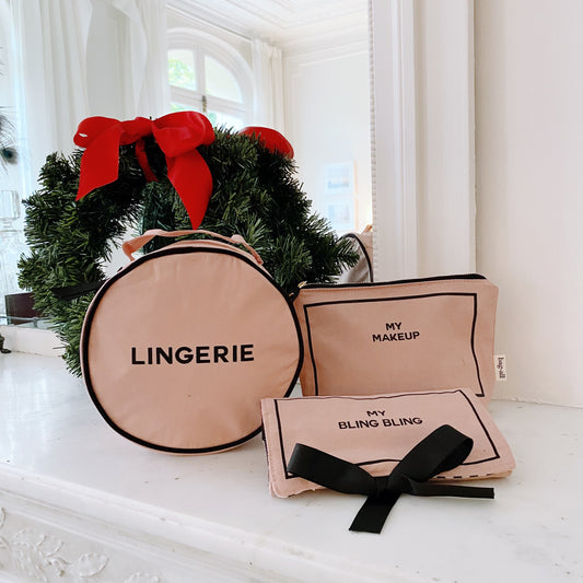 Bag-all pink blush gift set with round lingerie case, makeup pouch, and jewelry organizer with black ribbon bow