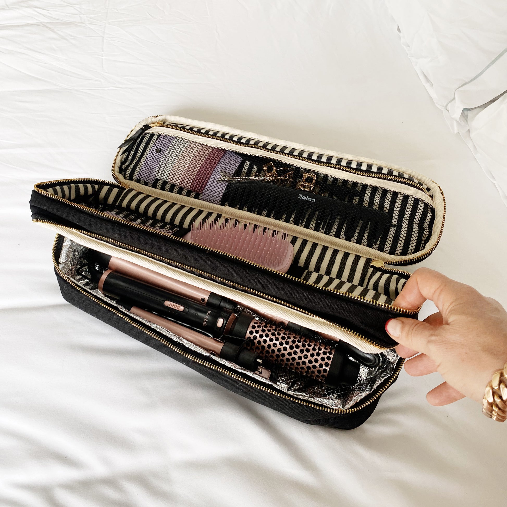 Bag-all Double Hair Tools Travel Case in black with heat-protective lining, featuring dual compartments for Dyson Airwrap and styling tools, striped interior organization