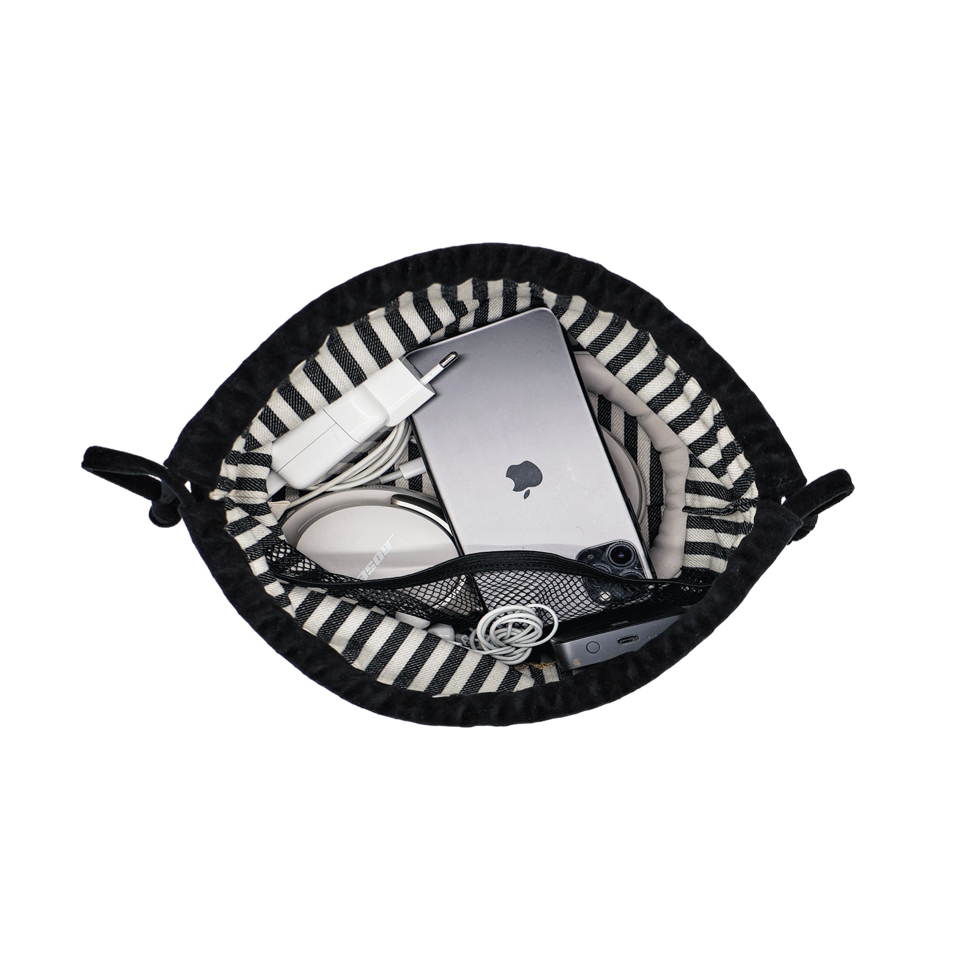 Drawstring black velvet tech pouch by Bag-all holding earbuds, charger, power bank, and cables neatly organized