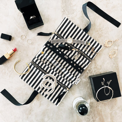Bag-all Deal Gift Set for Her featuring striped cotton cases for lingerie, makeup, and jewelry, displayed with accessories on white marble surface, black and white design