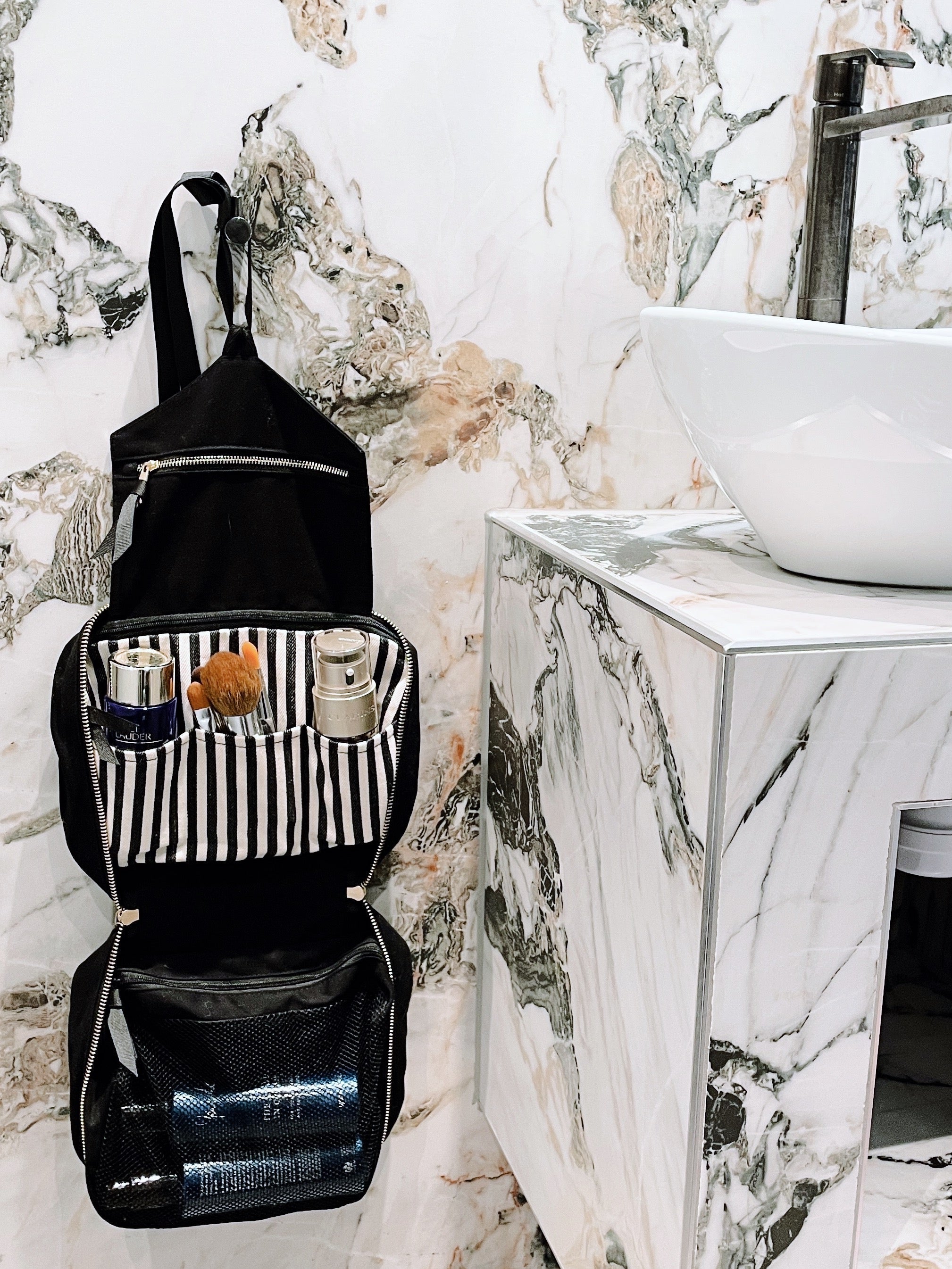 Bag-all black hanging toiletry organizer with multiple compartments for travel essentials bathroom setup