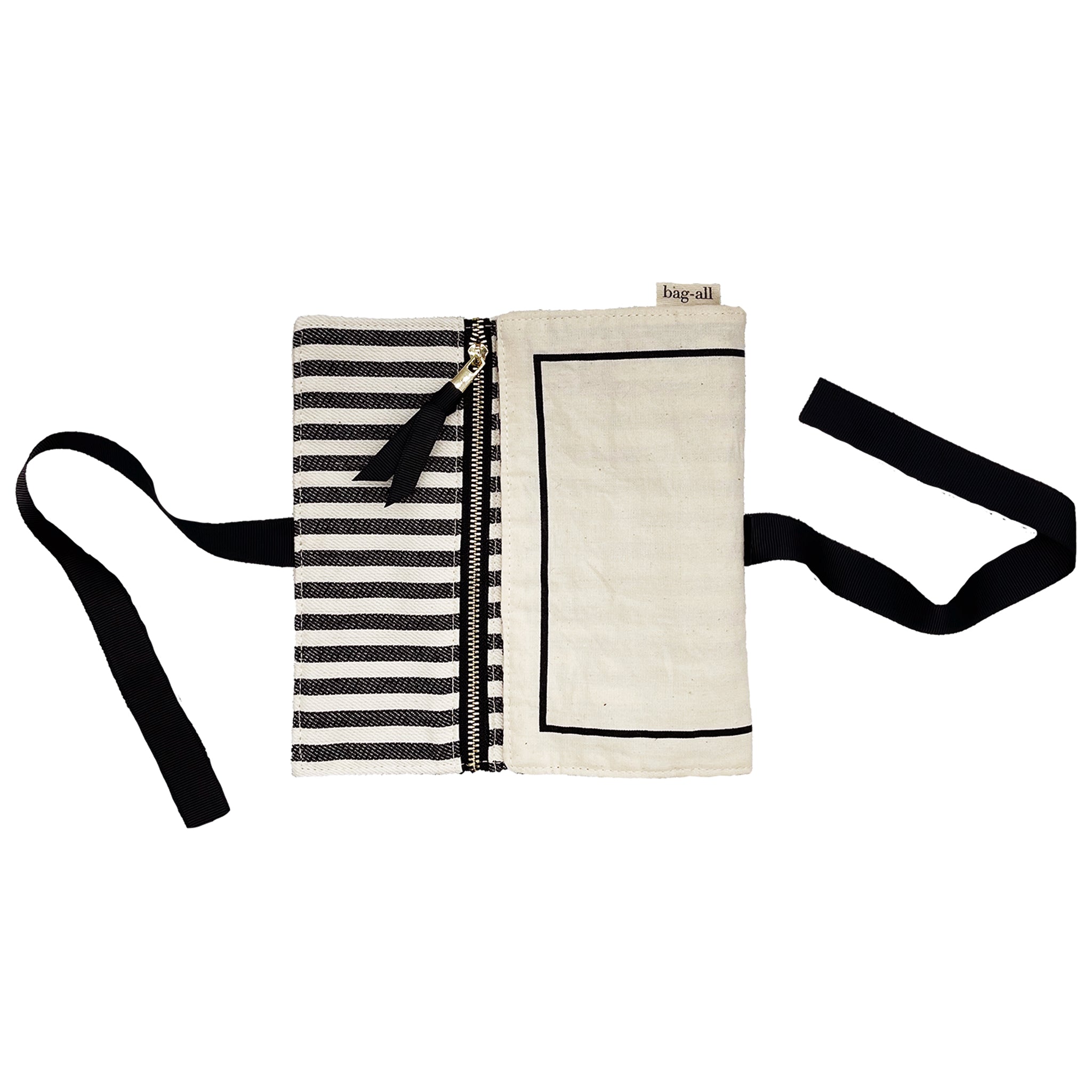 Bag-all Couture Jewelry Roll Medium in cream with striped interior lining, featuring three zip compartments, black trim details, and tie closure for elegant jewelry organization and travel