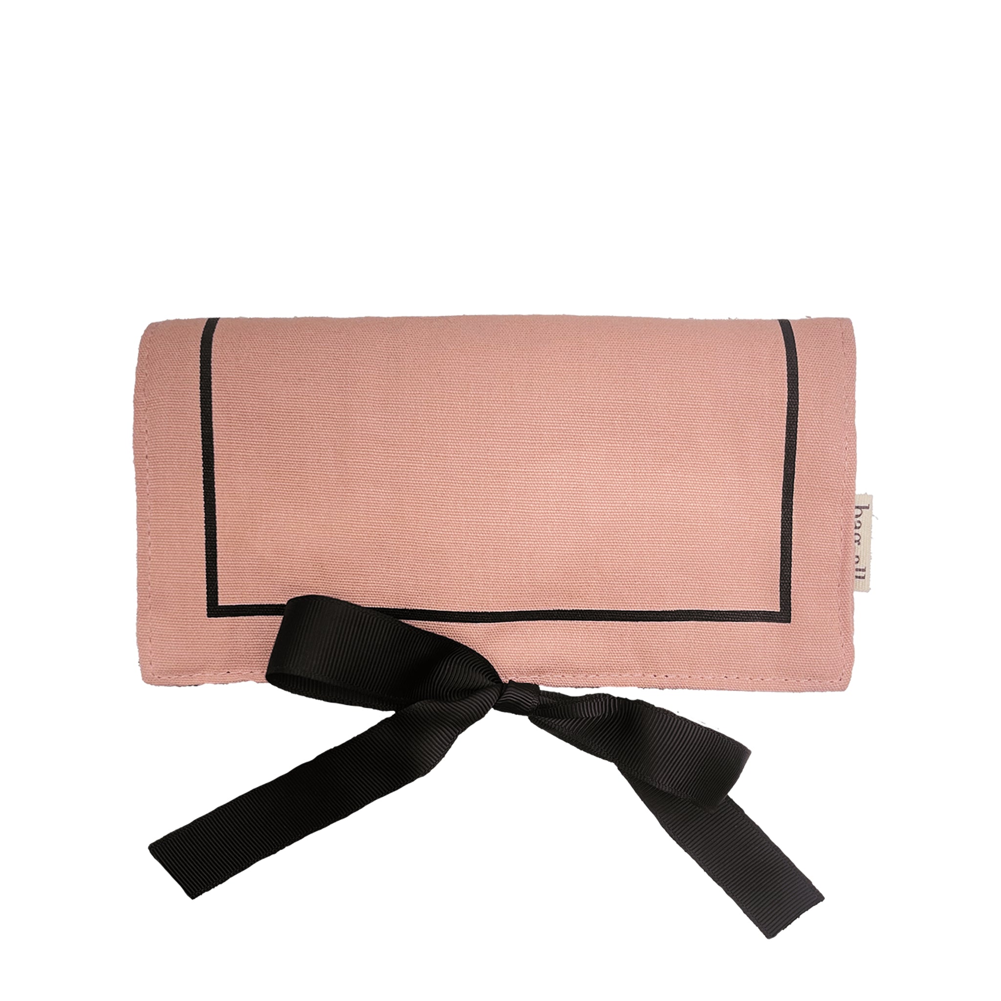 Bag-all Couture Jewelry Roll Medium in blush pink with black trim and bow, featuring elegant design for organized jewelry storage and travel