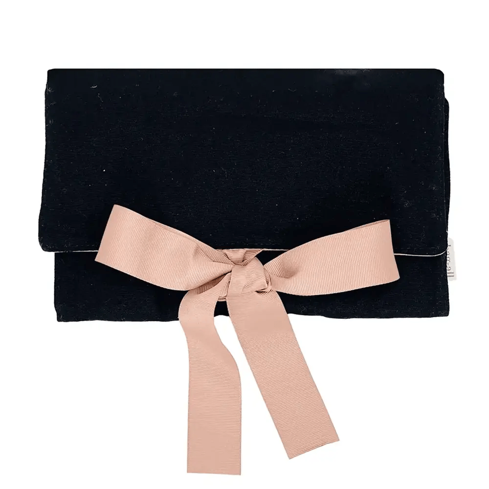 Bag-all Large Jewelry Roll in elegant black velvet with blush pink ribbon bow closure, perfect for organizing and protecting precious jewelry while traveling