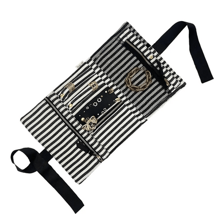 Bag-all black and white striped jewelry organizer roll with zipped compartments and ribbon tie for elegant storage
