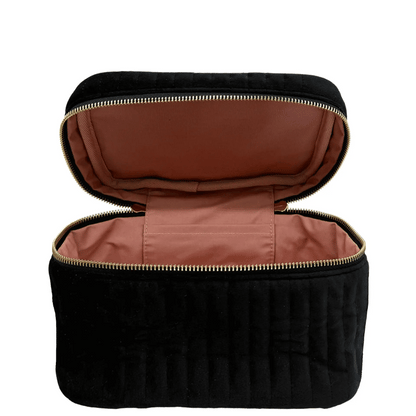 Black eco-velvet Bag-all makeup and jewelry case with gold zipper and soft pink interior lining open flat