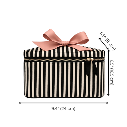Striped Bag-all medium box makeup and toiletry case with gold zipper and pink bow on white background