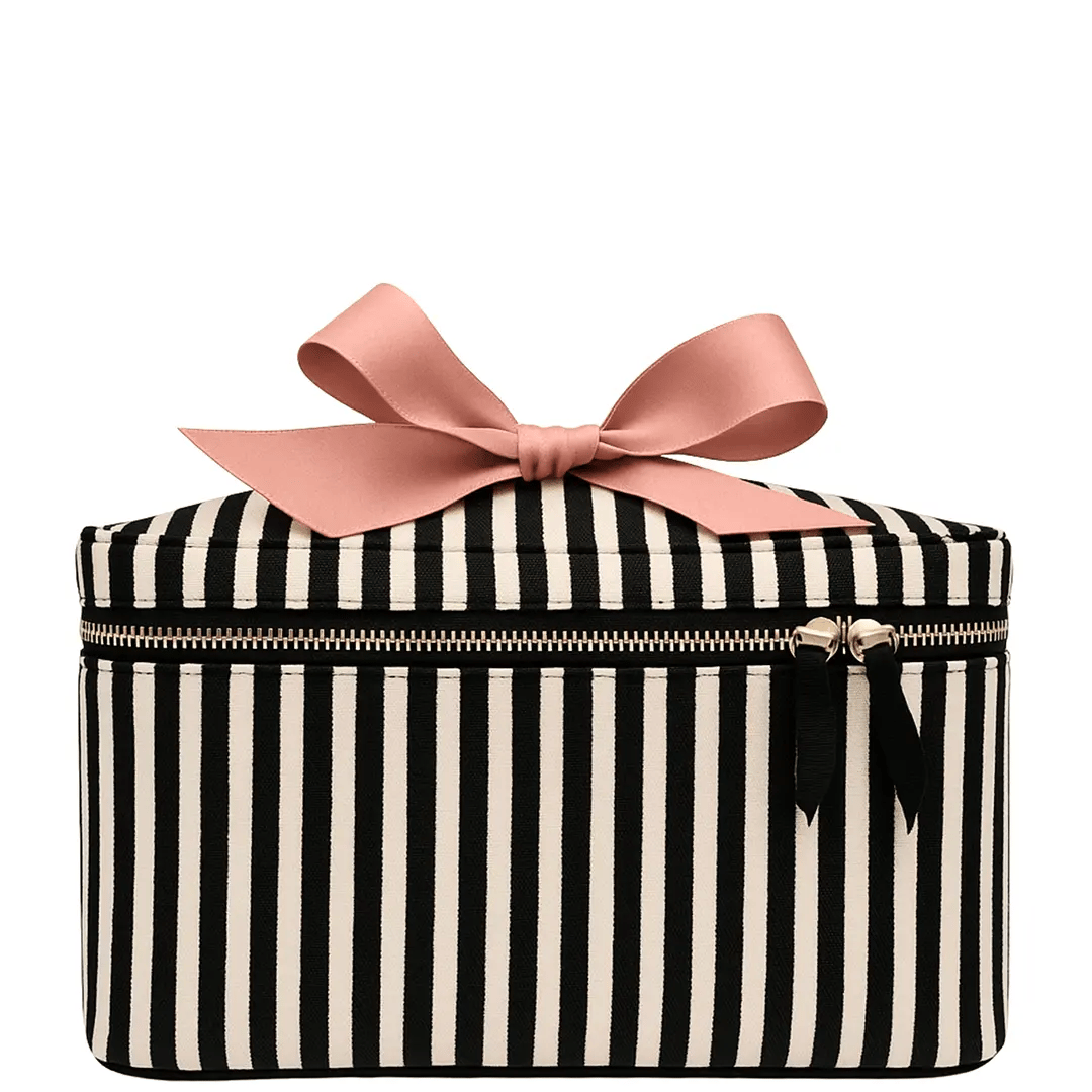 Bag-all medium box makeup and toiletry case striped with gold zipper and pink ribbon bow on white background
