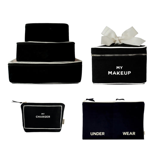 Bag-all Travel Glam 4-Pack featuring black cotton organizers with white trim - includes packing cubes, makeup box, charger pouch, and lingerie organizer for stylish travel storage