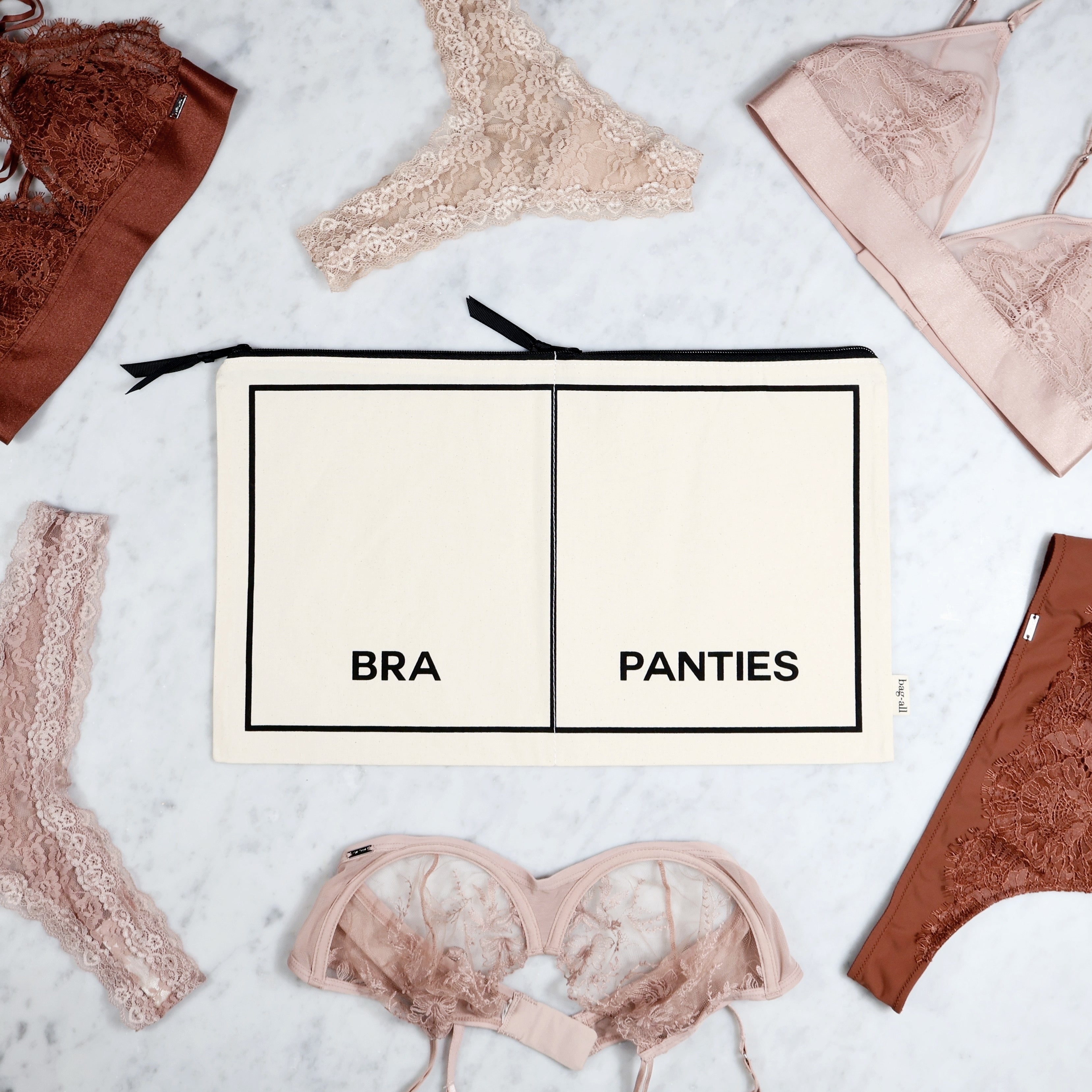 Bag-all cream Double Underwear Organizer with separate bra and panties compartments for travel and storage.