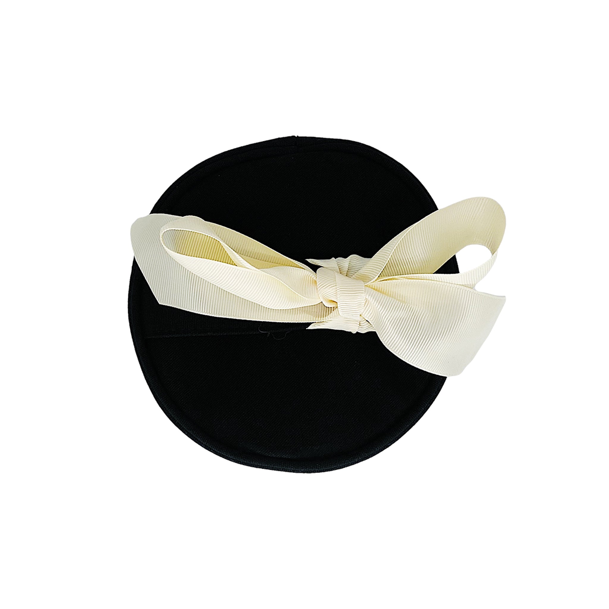 Bag-all Round Skin Care Case with Handle in Black, featuring an elegant cream bow accent, cylindrical design for organized beauty storage and travel