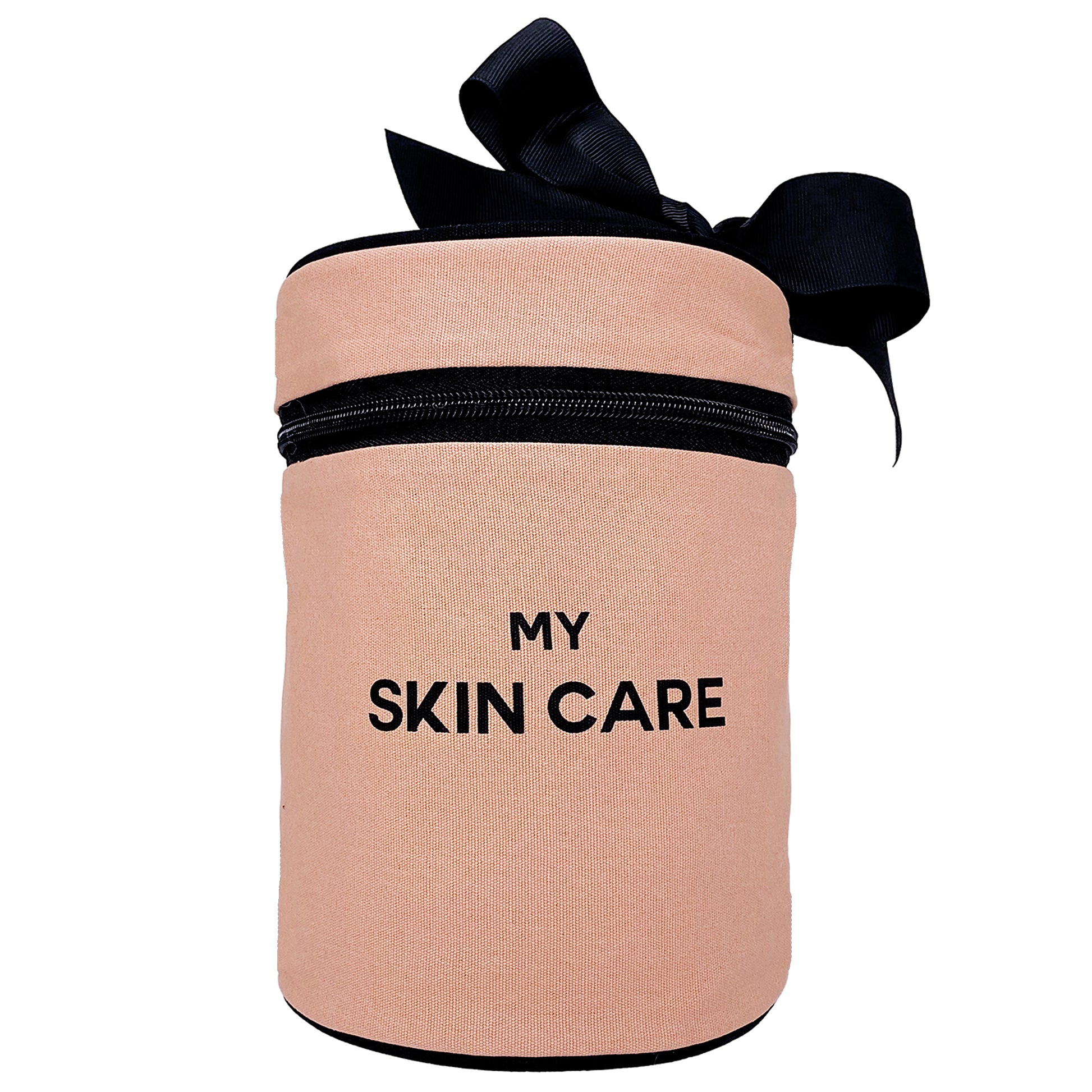 Bag-all Round Skin Care Case with Handle in blush pink featuring black bow accent and text, cylindrical storage organizer for beauty products