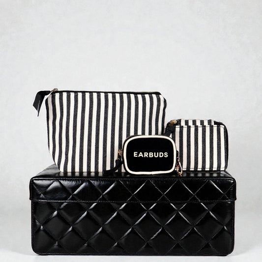 Bag-all striped Handbag Organizer Trio with trinket, makeup, and earbud cases on black quilted box background